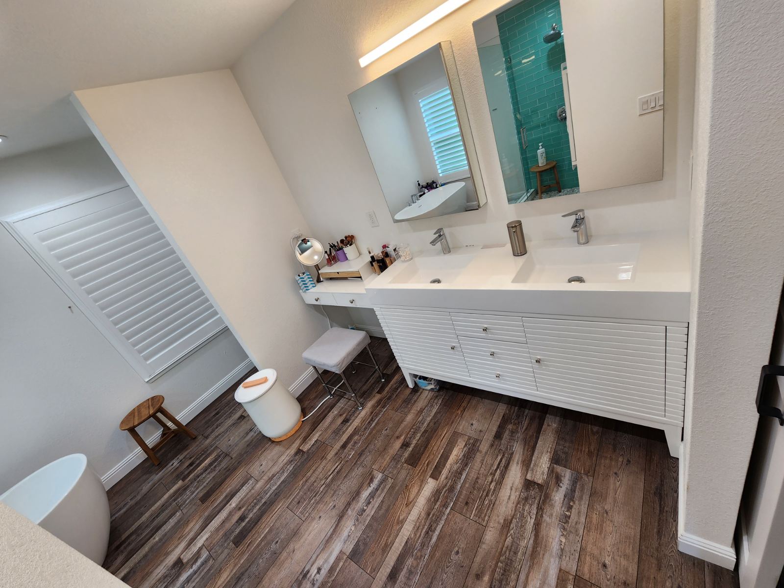 Bathroom Remodel, Vanity installed with sink and mirrors. Photo