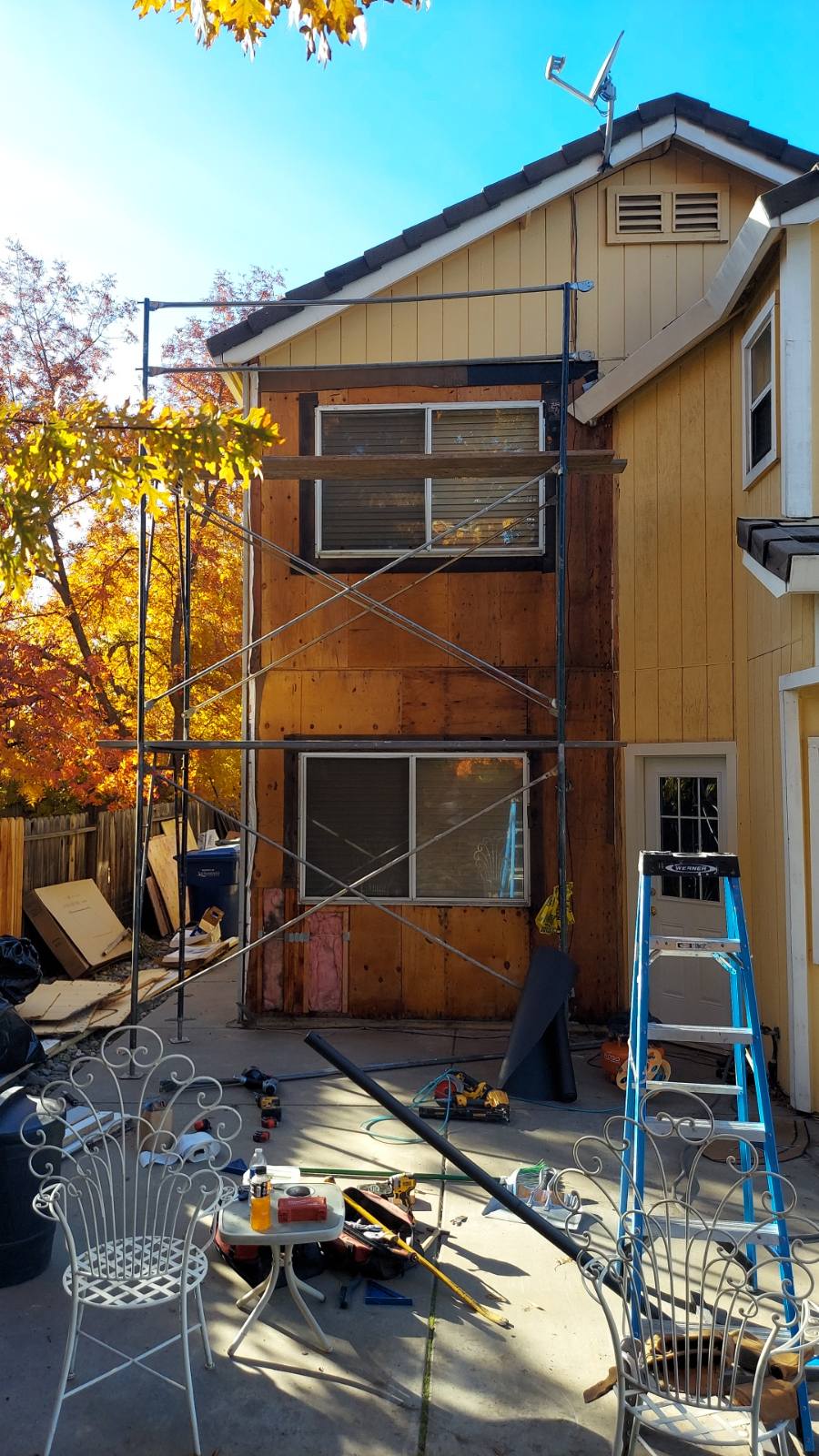 Damaged sheer wall from water leak, damaged window frames, damaged siding Photo