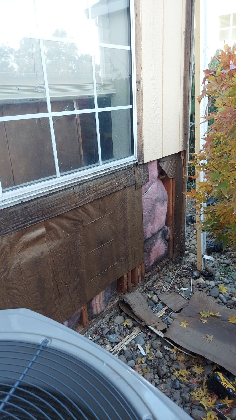 Water leak near window caused water leak underneath siding Photo