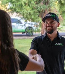 Good Life Construction team member greeting a homeowner at a residential property