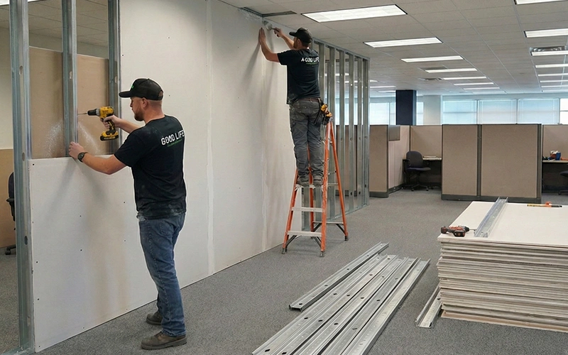 Good Life Construction team installing office walls in Sacramento
