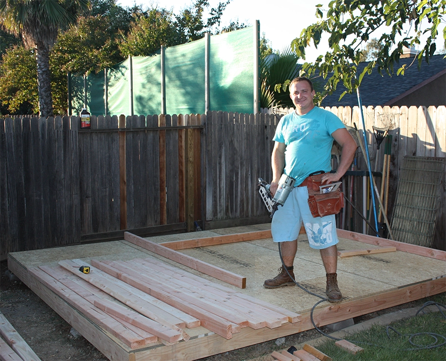 Dmitriy Tupikov working on a deck during the early years of Good Life Construction