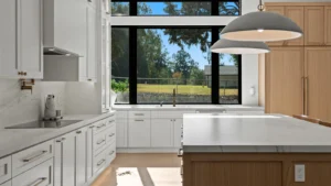 Completed Sacramento kitchen remodel with white cabinetry, quartz countertops, and a large center island